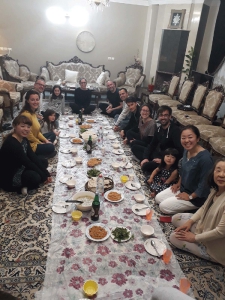 Gathering around Sofreh on the floor during Persian meals